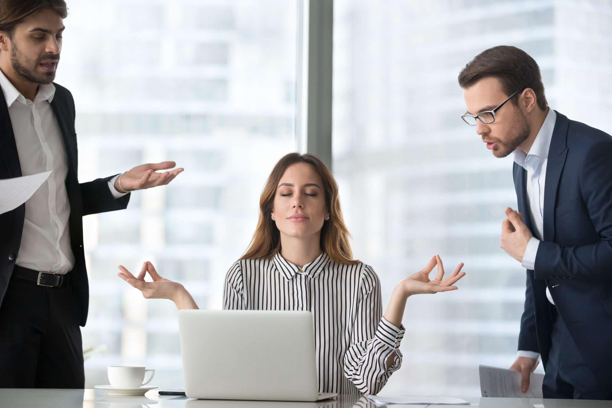 Calm female managing stress at workplace not involved in fights